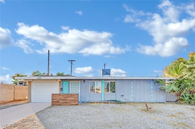 ranch-style house featuring a garage