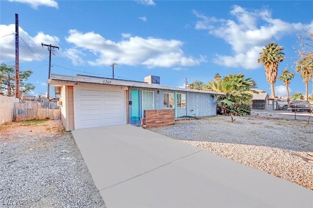 ranch-style home featuring a garage