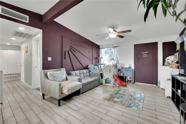 living room with ceiling fan and vaulted ceiling with beams