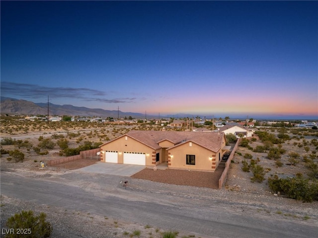 view of front of property featuring a mountain view and a garage