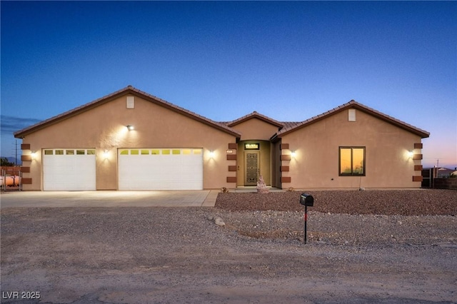 view of front of property with a garage