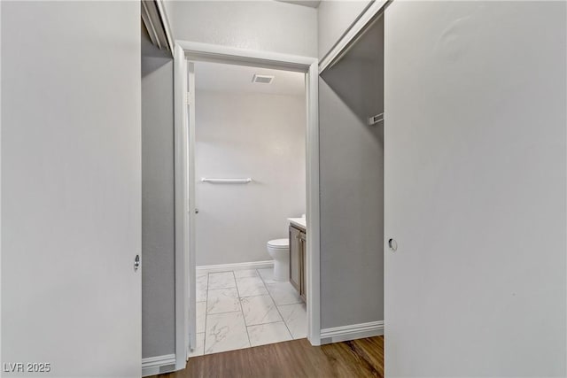 bathroom featuring toilet and vanity