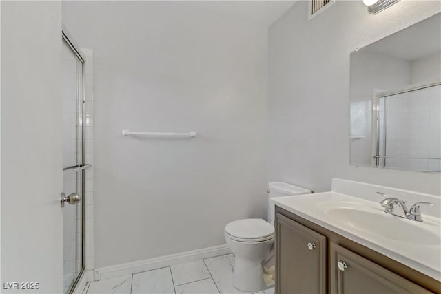 bathroom featuring toilet, an enclosed shower, and vanity