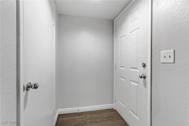 doorway featuring dark wood-type flooring