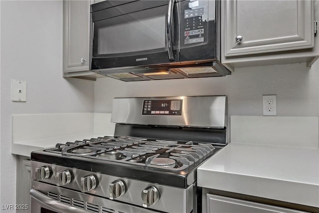 kitchen with white cabinetry and stainless steel range with gas stovetop