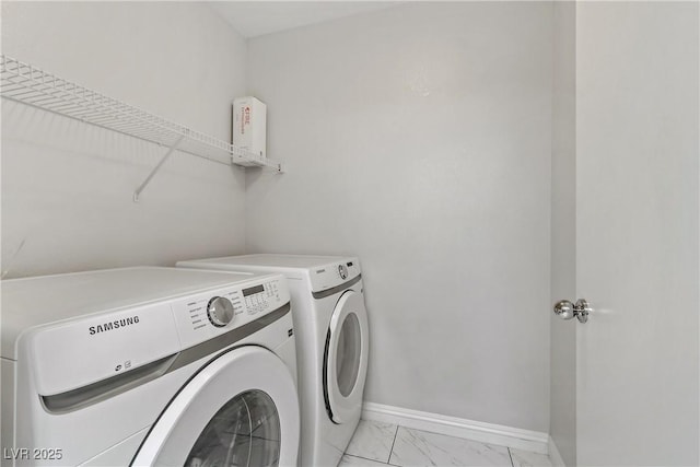 laundry room with washing machine and clothes dryer