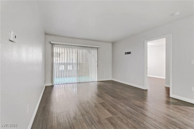 empty room featuring dark hardwood / wood-style floors