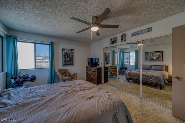 bedroom with ceiling fan, a textured ceiling, and a closet