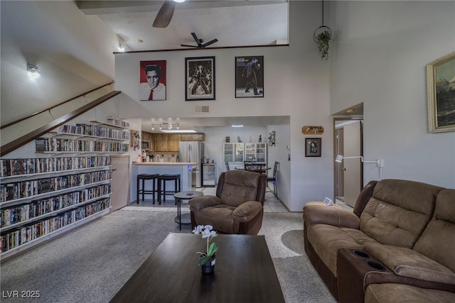 3791 Desert Marina Dr Unit 118, Laughlin, NV 89029 - living area featuring a towering ceiling, a ceiling fan, and carpet floors