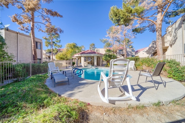 view of swimming pool with a patio