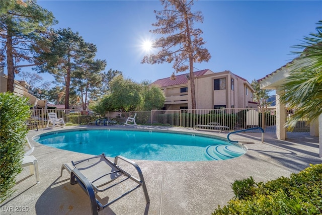 view of swimming pool with a patio area