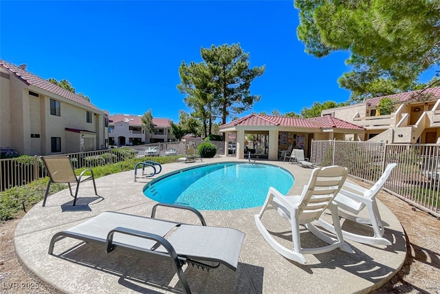 view of swimming pool with a patio