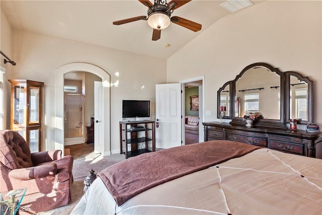 carpeted bedroom with vaulted ceiling and ceiling fan