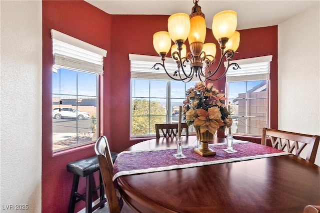 dining space with a notable chandelier