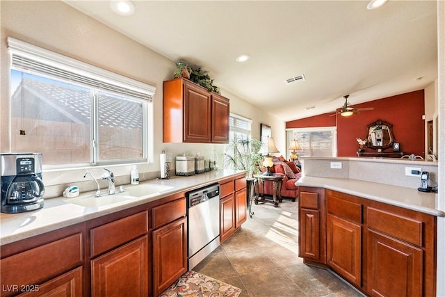 kitchen featuring sink, ceiling fan, dishwasher, and lofted ceiling