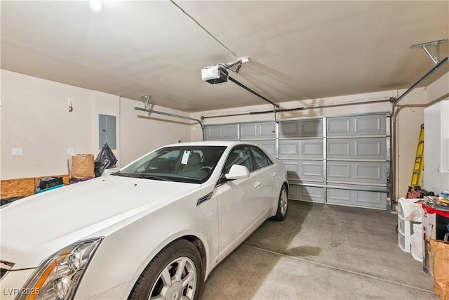 garage featuring electric panel and a garage door opener