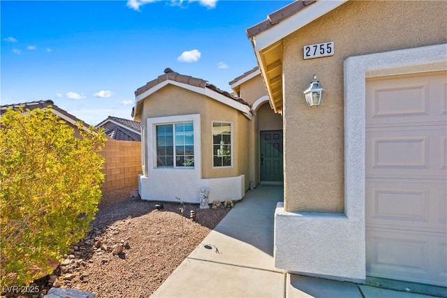 doorway to property featuring a garage