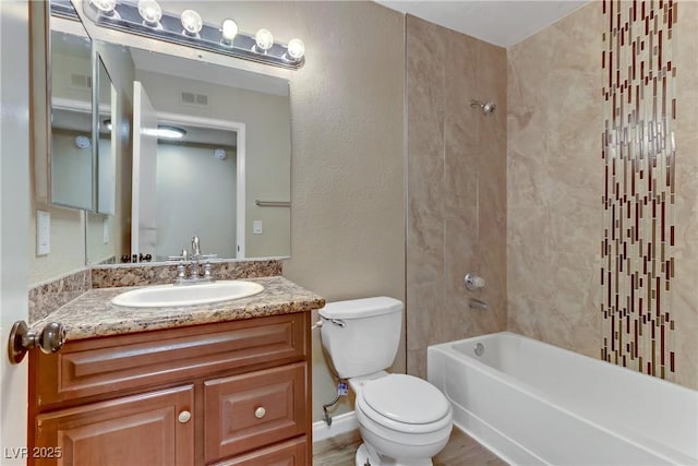 full bathroom with shower / bathing tub combination, vanity, toilet, and hardwood / wood-style floors