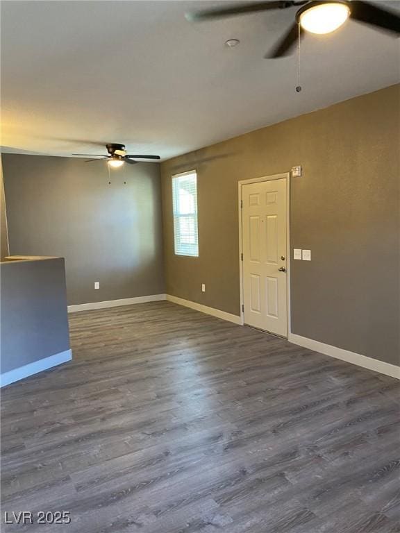 spare room featuring ceiling fan and wood-type flooring