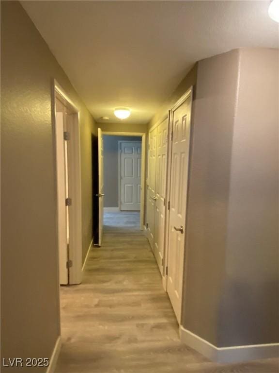 hallway featuring light wood-type flooring