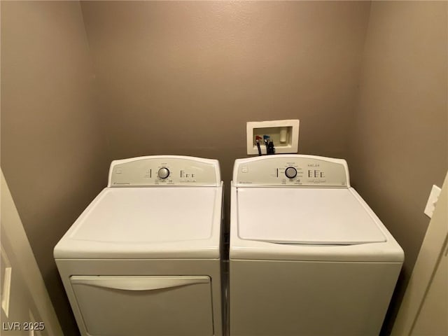 washroom featuring washer and clothes dryer