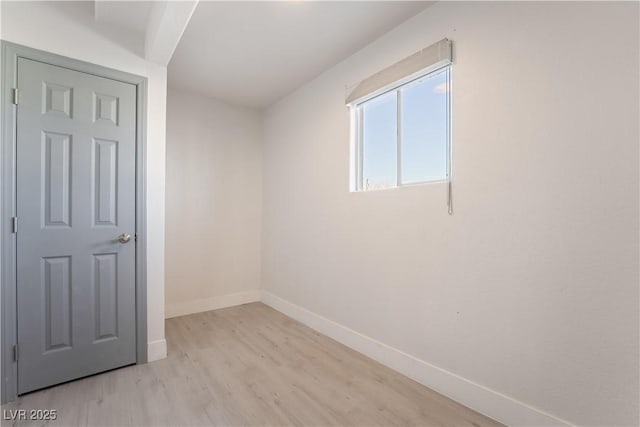 spare room with light hardwood / wood-style flooring