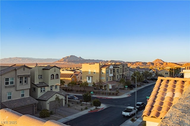 property's view of city featuring a residential view and a mountain view