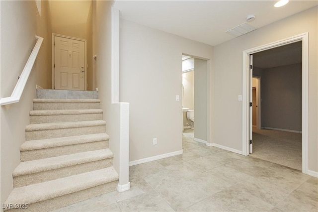 stairway with baseboards