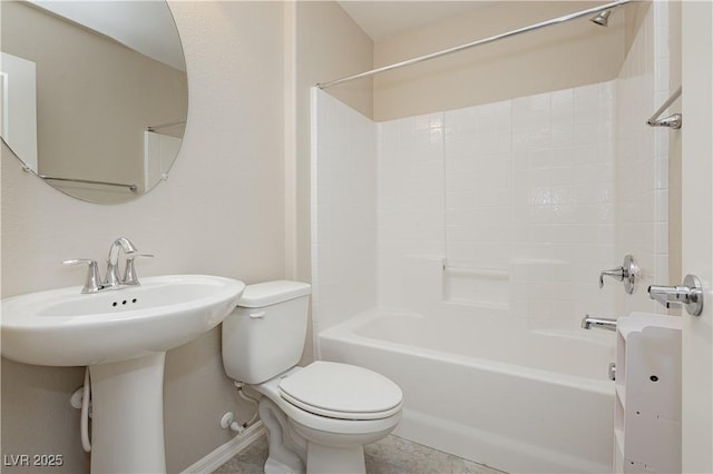 bathroom with bathing tub / shower combination and toilet