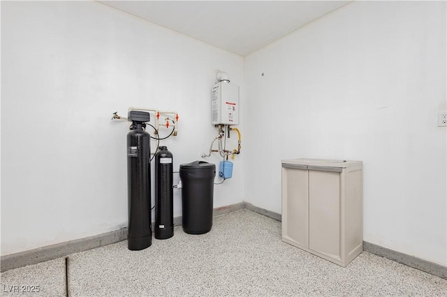 utility room featuring water heater