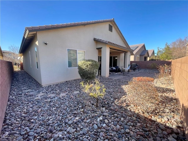 rear view of property with a patio area