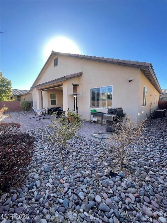 back of house featuring a patio area