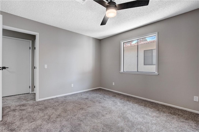 unfurnished room with light carpet, ceiling fan, and a textured ceiling