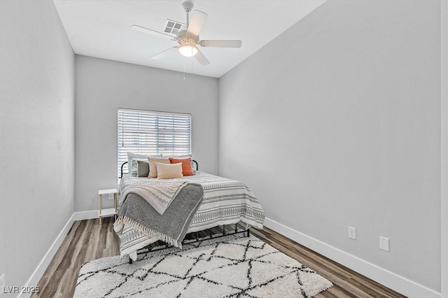 bedroom featuring hardwood / wood-style floors and ceiling fan