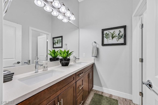 bathroom featuring hardwood / wood-style flooring and vanity