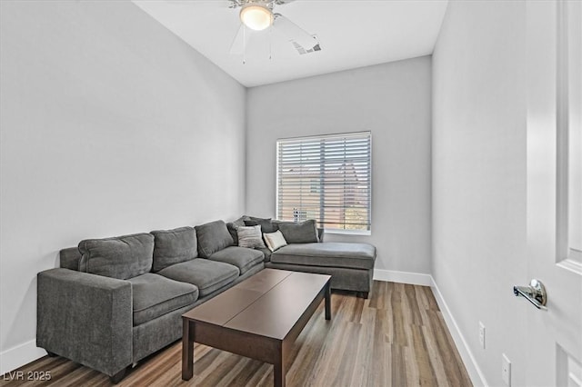 living room with ceiling fan and wood-type flooring