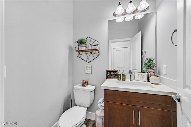 bathroom with toilet and vanity