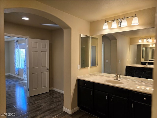 bathroom with wood-type flooring and vanity