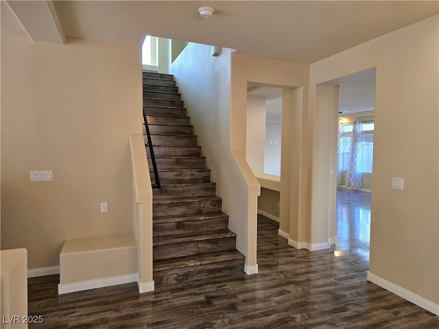 stairway with hardwood / wood-style floors