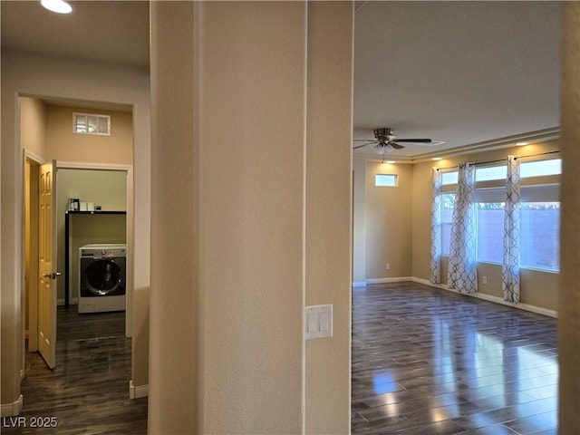 interior space featuring washer / dryer and dark hardwood / wood-style flooring