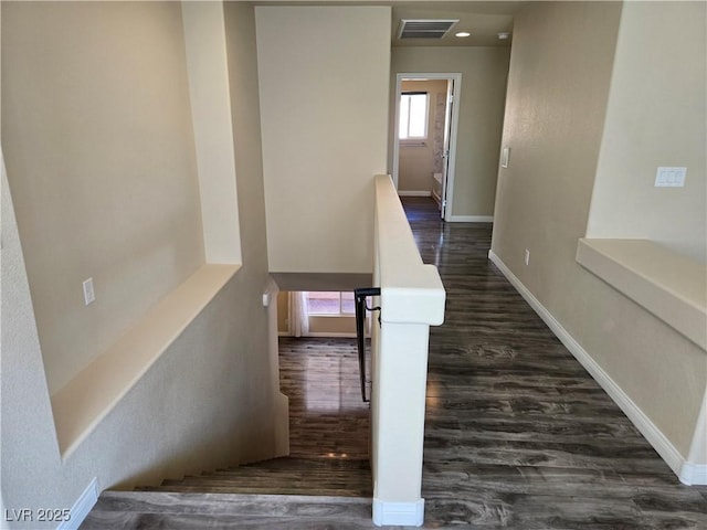 stairway with hardwood / wood-style flooring