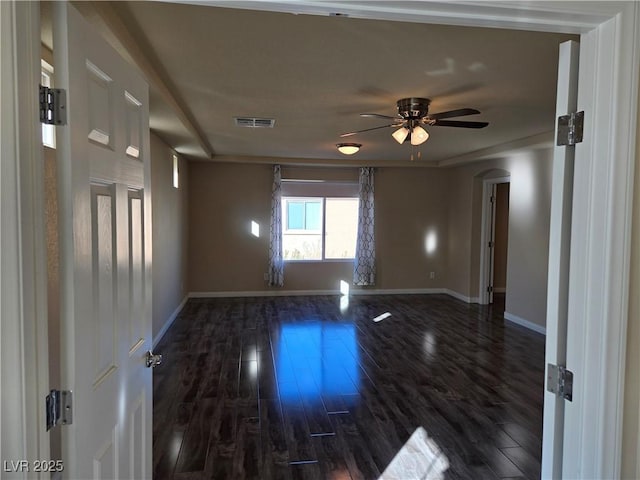 unfurnished room featuring ceiling fan and dark hardwood / wood-style floors