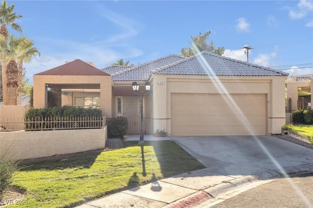 view of front of house with a garage and a front lawn