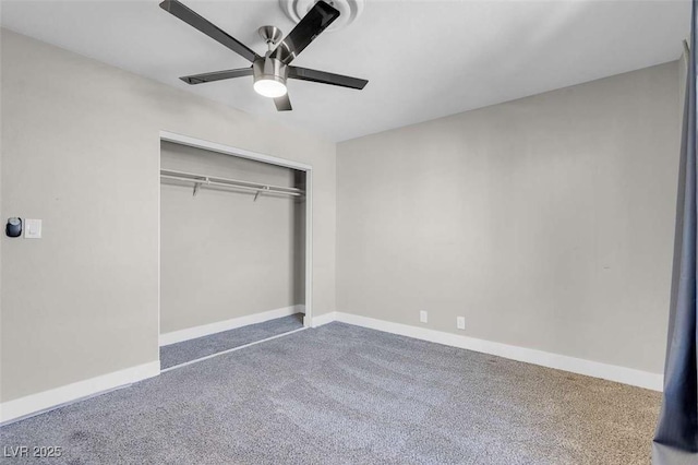 unfurnished bedroom featuring ceiling fan, a closet, and carpet