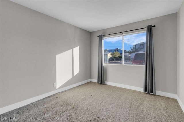 spare room featuring carpet flooring