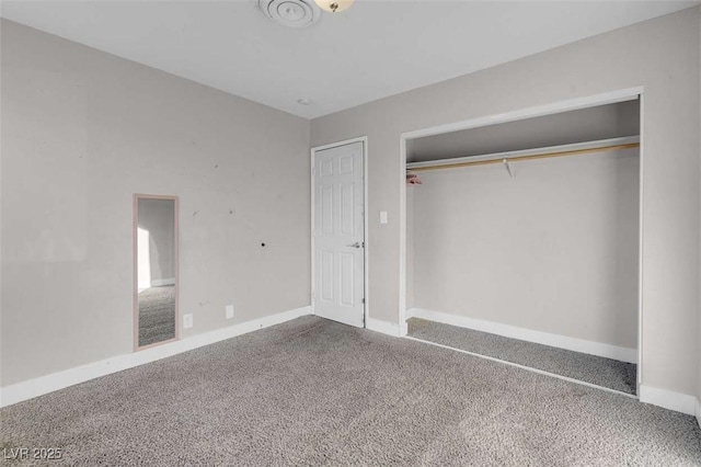 unfurnished bedroom featuring a closet and carpet flooring