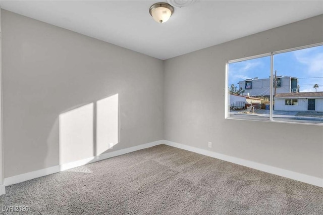 spare room featuring carpet flooring