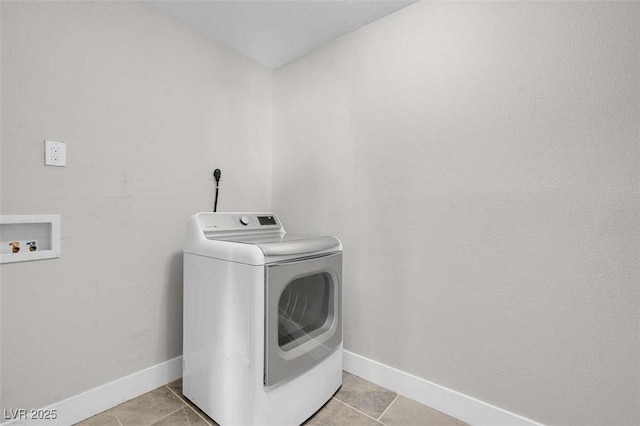 laundry room featuring light tile patterned flooring and washer / clothes dryer