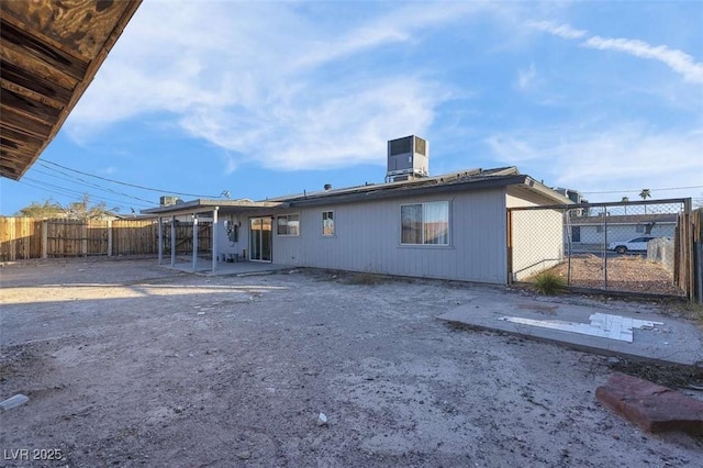 back of property with a patio area and cooling unit