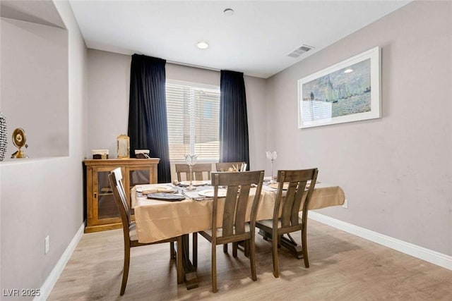 dining room featuring light hardwood / wood-style flooring